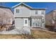 Cozy backyard with a concrete patio featuring a table and chairs for outdoor dining at 12133 Hannibal St, Commerce City, CO 80603