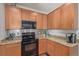 Kitchen featuring granite countertops, stainless steel appliances, and hardwood floor at 12133 Hannibal St, Commerce City, CO 80603