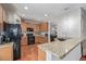Kitchen featuring granite countertops, wooden cabinets, and stainless steel appliances at 12133 Hannibal St, Commerce City, CO 80603