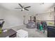 Spacious loft area with carpet flooring, ceiling fan, and a comfortable beanbag chair at 12133 Hannibal St, Commerce City, CO 80603