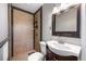Modern bathroom with tiled shower, new sink, and updated vanity at 1560 Pueblo Ct, Thornton, CO 80229