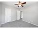 This bedroom features neutral walls, carpeted floors, and a ceiling fan with an overhead light at 1560 Pueblo Ct, Thornton, CO 80229