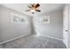 Serene bedroom featuring neutral walls, a ceiling fan, and natural light at 1560 Pueblo Ct, Thornton, CO 80229
