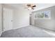 Neutral bedroom with a ceiling fan, window, and closet space at 1560 Pueblo Ct, Thornton, CO 80229