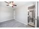 Spacious bedroom with new carpet, ceiling fan, and ample closet space at 1560 Pueblo Ct, Thornton, CO 80229