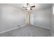 This bedroom has neutral walls, carpeted floors, and a ceiling fan with overhead lighting at 1560 Pueblo Ct, Thornton, CO 80229