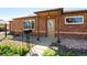 Charming single-story brick home with a cozy covered entry and well-maintained front yard at 1560 Pueblo Ct, Thornton, CO 80229