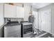 Functional laundry room with new washer/dryer, water heater, and convenient exterior access at 1560 Pueblo Ct, Thornton, CO 80229