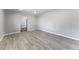 Bright living room with new wood-look flooring and fresh neutral paint at 1560 Pueblo Ct, Thornton, CO 80229