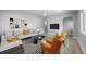 Bright living room features contemporary decor, modern furniture, and stylish striped rug at 1560 Pueblo Ct, Thornton, CO 80229