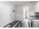 Mud room featuring modern washer/dryer hookups and convenient exterior access at 1560 Pueblo Ct, Thornton, CO 80229