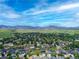 Breathtaking aerial view of a neighborhood with mountain views in the background at 3343 S Newcombe St, Lakewood, CO 80227