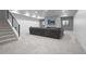 Spacious basement with plush carpet, stone fireplace, and comfortable seating for entertainment at 3343 S Newcombe St, Lakewood, CO 80227