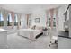 Bright bedroom with plush carpet and large windows showcases a comfortable and inviting space at 3343 S Newcombe St, Lakewood, CO 80227