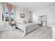 Bright bedroom with plush carpet and large windows showcases a comfortable and inviting space at 3343 S Newcombe St, Lakewood, CO 80227