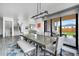The open-concept dining room features modern fixtures and ample seating at 3343 S Newcombe St, Lakewood, CO 80227