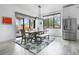 Dining area features modern fixtures, outdoor access, and stainless appliances at 3343 S Newcombe St, Lakewood, CO 80227