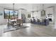 Bright, open kitchen with a large island, modern appliances, and a dining area with large windows at 3343 S Newcombe St, Lakewood, CO 80227