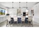 Modern kitchen island featuring white countertops, a navy blue base, and seating for four at 3343 S Newcombe St, Lakewood, CO 80227
