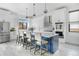 Eat in kitchen showcases stainless steel appliances, white cabinets and a center island at 3343 S Newcombe St, Lakewood, CO 80227