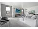 The living room has a stone fireplace and electric firebox at 3343 S Newcombe St, Lakewood, CO 80227
