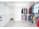 Spacious walk-in closet with built-in shelving, ample storage space, and carpet flooring at 3343 S Newcombe St, Lakewood, CO 80227