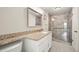 Bathroom featuring granite countertops and tiled walk-in shower with safety bar at 6988 S Knolls Way, Centennial, CO 80122