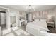Light and airy bedroom with a vanity, large mirror, neutral colors, and stylish decor at 6988 S Knolls Way, Centennial, CO 80122