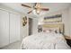 Cozy bedroom featuring a ceiling fan and ample closet space, perfect for comfortable living at 6988 S Knolls Way, Centennial, CO 80122