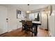 Bright dining room with modern lighting and stylish table setting at 6988 S Knolls Way, Centennial, CO 80122