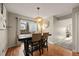 Inviting dining room with wood floors, decorative lighting and access to the outdoor patio at 6988 S Knolls Way, Centennial, CO 80122
