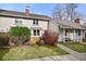 Charming two-story home with well-maintained lawn and mature landscaping at 6988 S Knolls Way, Centennial, CO 80122