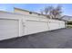 Attached garages offering convenient parking and additional storage space for residents at 6988 S Knolls Way, Centennial, CO 80122