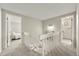 Upstairs hallway, neutral colors, with carpet leading to bedroom and bathroom entrances at 6988 S Knolls Way, Centennial, CO 80122