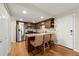 Updated kitchen featuring granite countertops, stainless steel appliances, and breakfast bar seating at 6988 S Knolls Way, Centennial, CO 80122