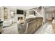 Cozy living room with fireplace, plush seating, and bright, neutral decor at 6988 S Knolls Way, Centennial, CO 80122