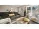 Spacious living room with comfortable seating and ample natural light at 6988 S Knolls Way, Centennial, CO 80122