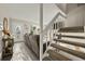 Welcoming living room and staircase featuring neutral tones and carpet at 6988 S Knolls Way, Centennial, CO 80122