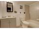 Basement bathroom with gray tile and a vanity at 14602 E 2Nd Ave # 100C, Aurora, CO 80011