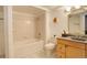 Clean bathroom with a shower/tub combo and light wood vanity at 14602 E 2Nd Ave # 100C, Aurora, CO 80011