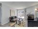 Bright living room with fireplace and sliding glass door leading to patio at 14602 E 2Nd Ave # 100C, Aurora, CO 80011