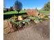 Landscaped entrance to Emerald Greens Golf Club featuring a prominent stone sign at 755 S Clinton St # 1B, Denver, CO 80247