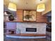 Lobby with stone fireplace, wood accents, and decorative lighting at 755 S Clinton St # 1B, Denver, CO 80247