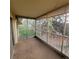 Relaxing screened-in patio features serene neighborhood views and plenty of natural light at 755 S Clinton St # 1B, Denver, CO 80247