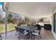 Spacious backyard patio with a dining table, lounge furniture, and a lush green lawn at 10385 E Ida Ave, Greenwood Village, CO 80111