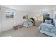 Bright bedroom featuring two twin beds with blue bedding and white walls at 10385 E Ida Ave, Greenwood Village, CO 80111