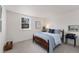 Neutral bedroom with a full size bed, white walls, carpeted floor and large window at 10385 E Ida Ave, Greenwood Village, CO 80111