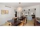 Elegant dining room with hardwood floors, modern lighting, and seamless flow into the living area at 10385 E Ida Ave, Greenwood Village, CO 80111
