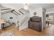 Bright entryway featuring hardwood floors, a staircase, and a view into the living and dining areas at 10385 E Ida Ave, Greenwood Village, CO 80111