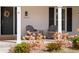 Charming front porch featuring a decorative wreath, seating, and address number at 10385 E Ida Ave, Greenwood Village, CO 80111